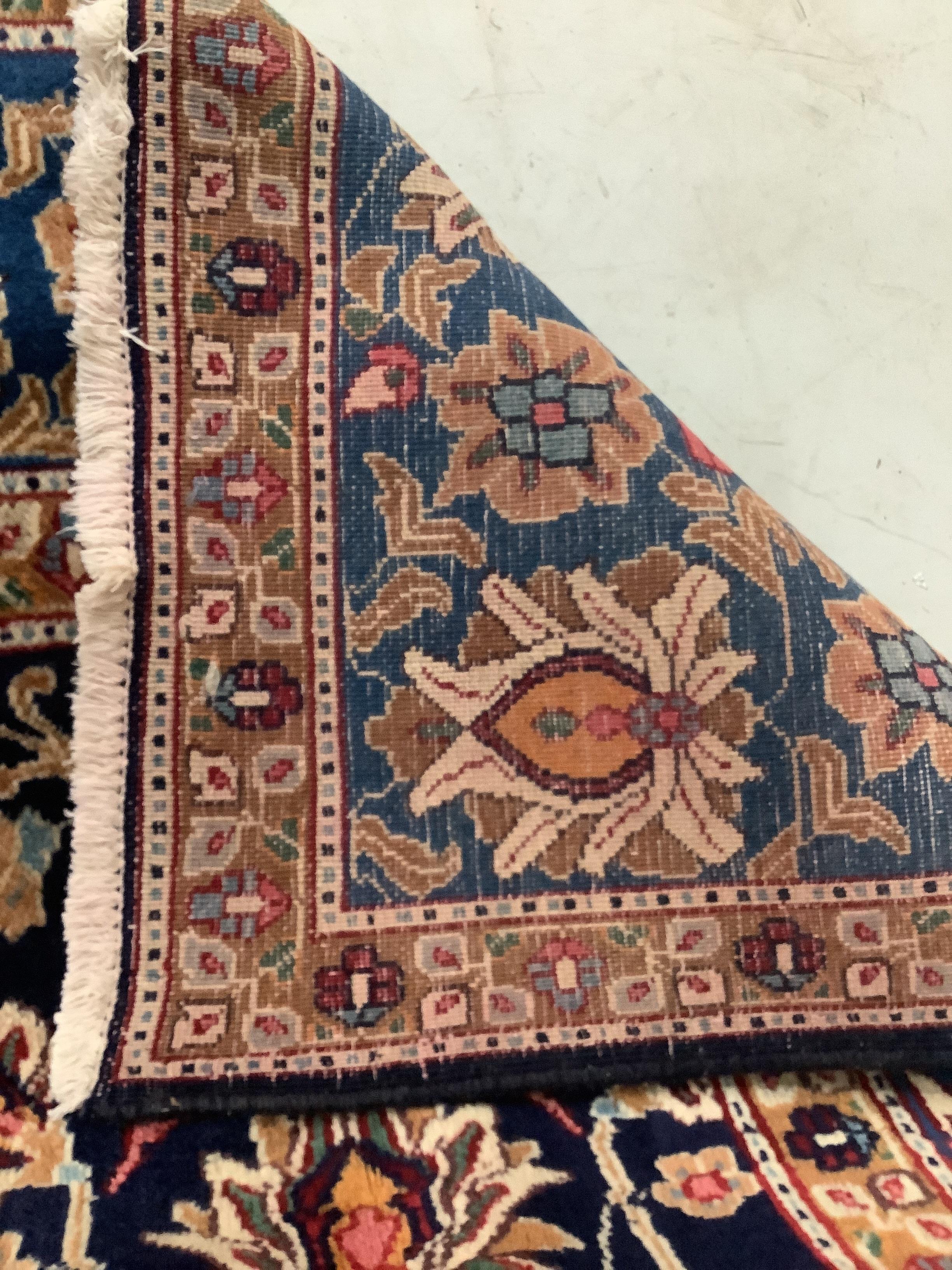 A Kashan blue ground carpet, 290 x 195cm